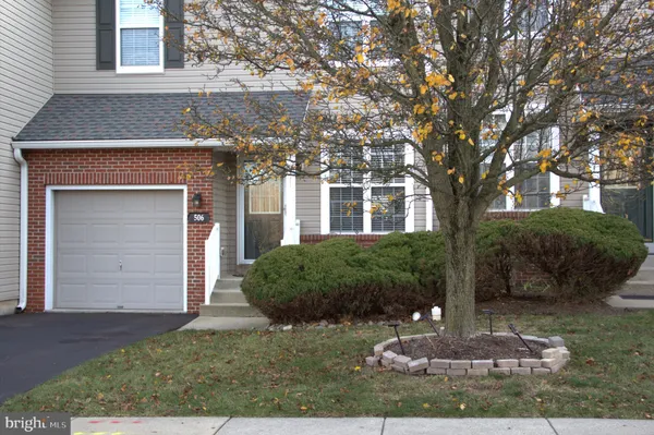 front view of a house with a garden