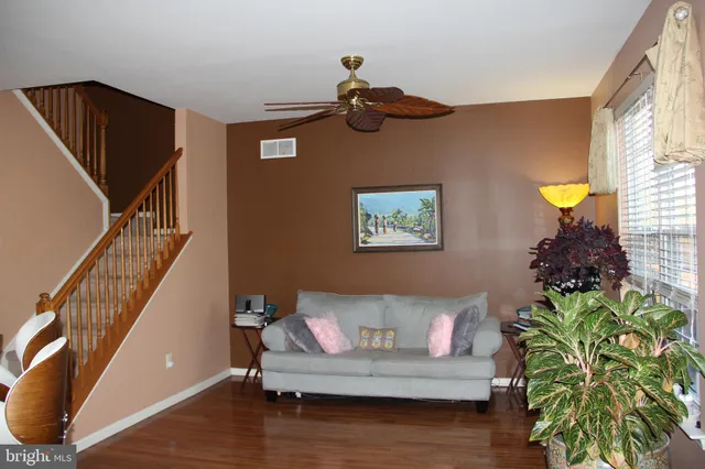 a view of room with furniture and wooden floor