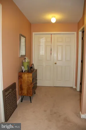 a spacious bedroom with a bed and a television