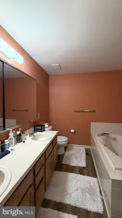 a view of balcony with wooden floor and outdoor seating