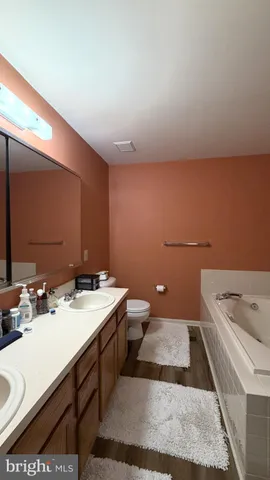 a view of a dining room with furniture and a potted plant