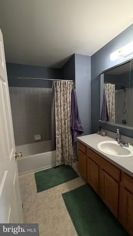 a bathroom with a bathtub and toilet