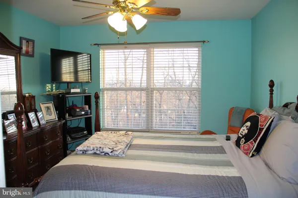 a view of outdoor space with green field and trees
