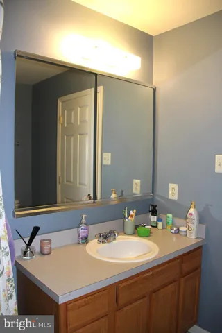 a backyard of apartments with large trees