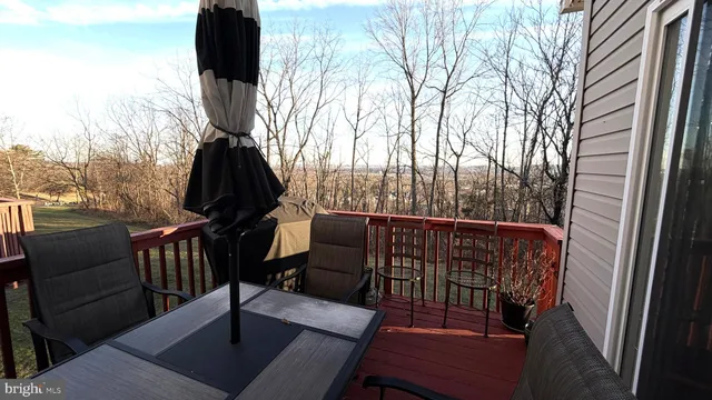 a view of outdoor space with green field and trees