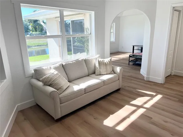 a living room with furniture and a window
