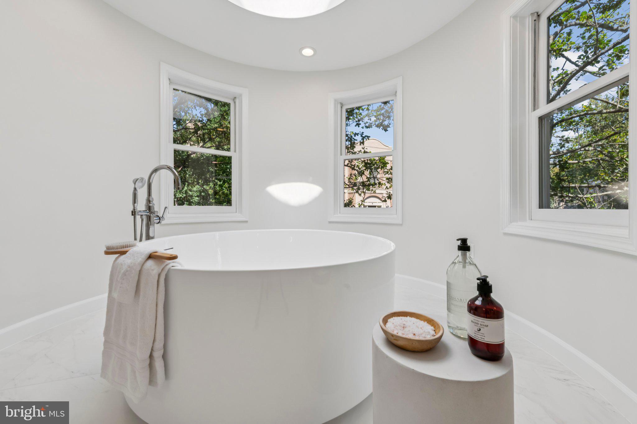 4730 Foxhall Crescent Northwest Washington, DC 20007 - Photo 22 of 37 a bathroom with a sink toilet and window