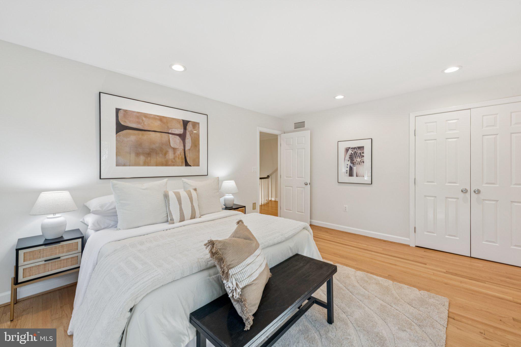 4730 Foxhall Crescent Northwest Washington, DC 20007 - Photo 23 of 37 a bedroom with a bed and a painting on the wall