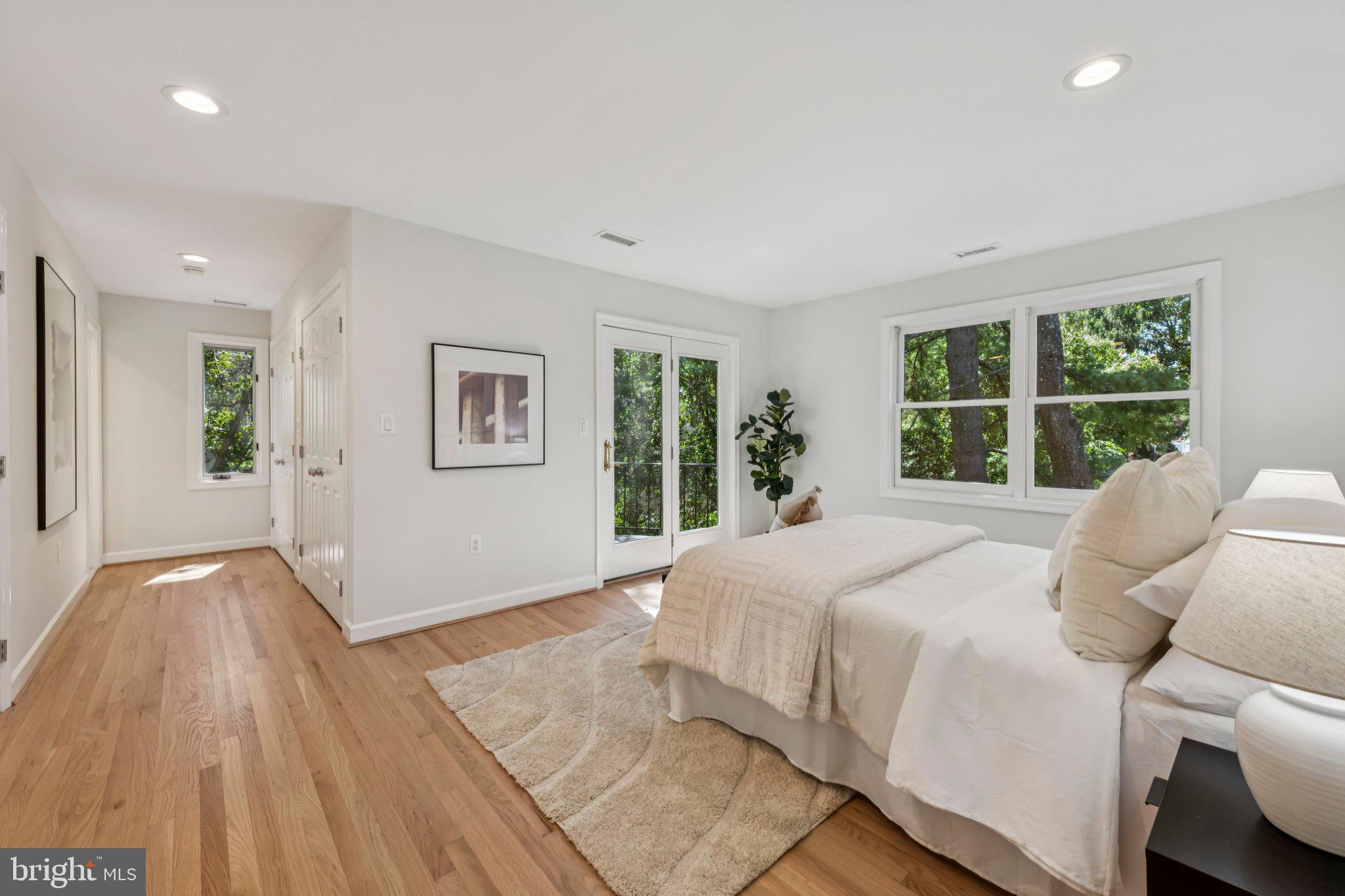 4730 Foxhall Crescent Northwest Washington, DC 20007 - Photo 24 of 37 a bedroom with a large bed and a window
