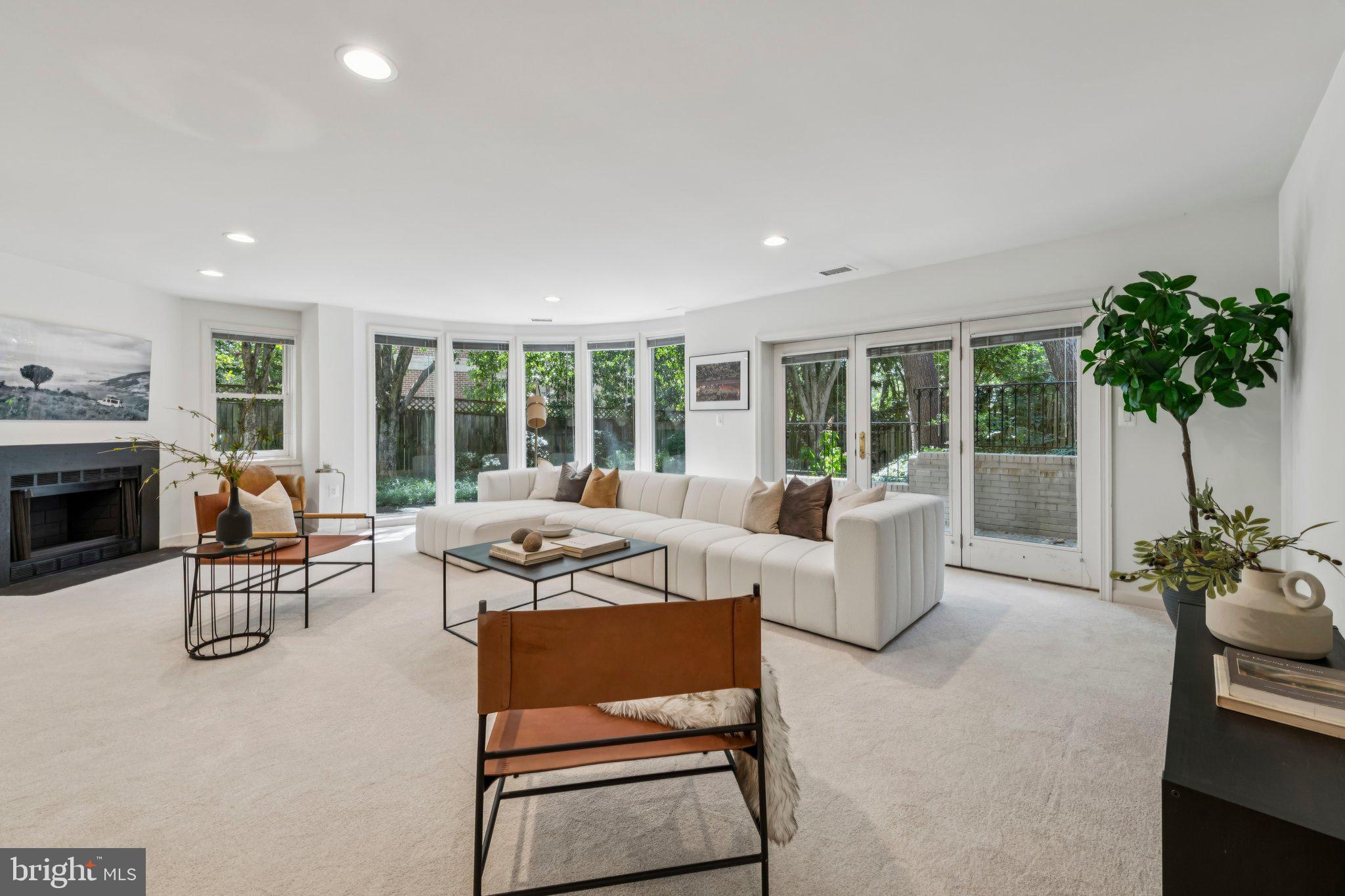 4730 Foxhall Crescent Northwest Washington, DC 20007 - Photo 28 of 37 a living room with furniture and a floor to ceiling window