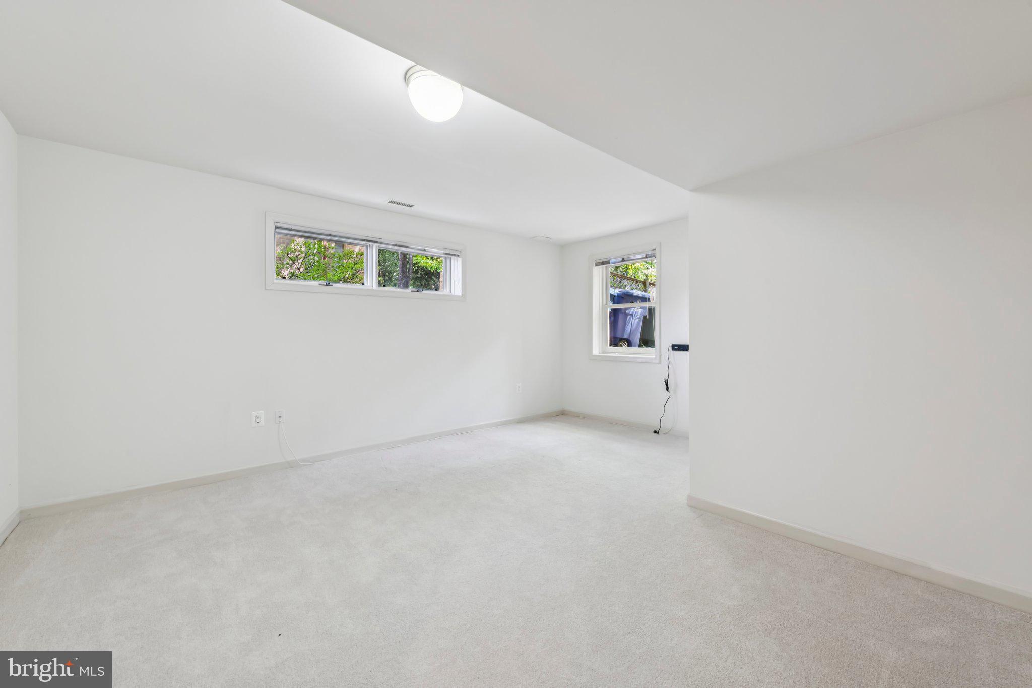 4730 Foxhall Crescent Northwest Washington, DC 20007 - Photo 31 of 37 an empty room with painting on the wall