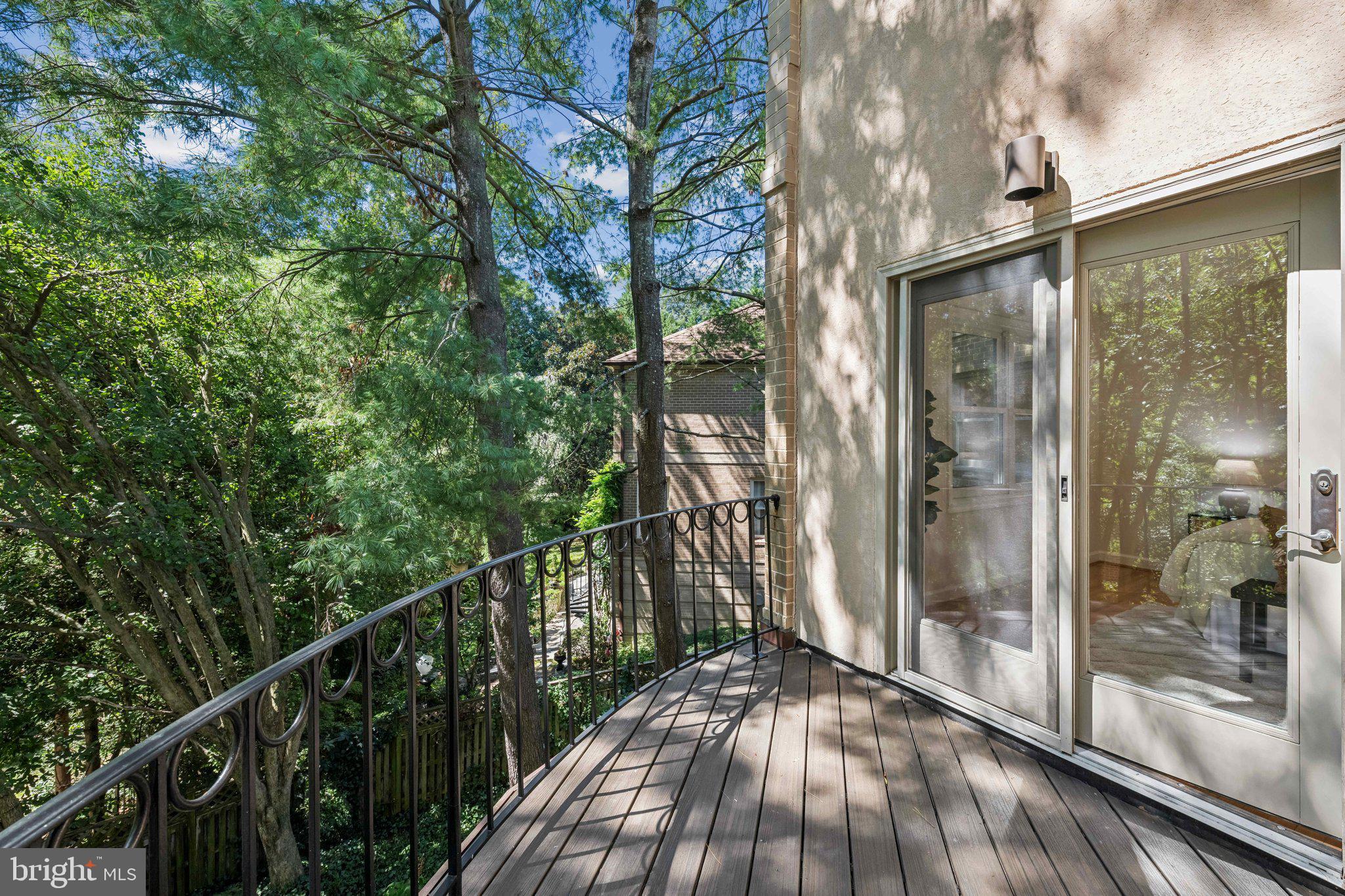 4730 Foxhall Crescent Northwest Washington, DC 20007 - Photo 36 of 37 a view of a balcony with wooden floor and fence