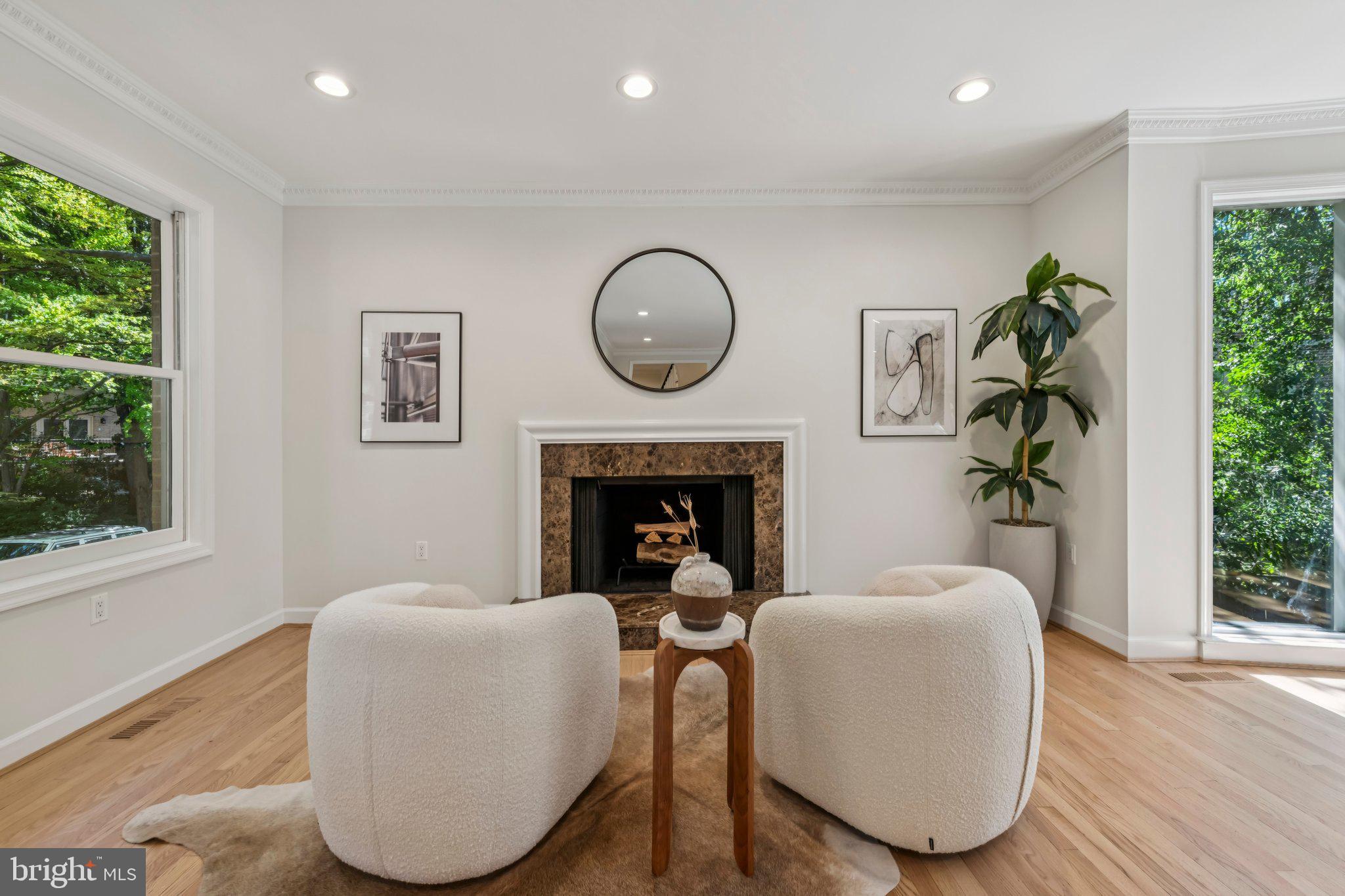 4730 Foxhall Crescent Northwest Washington, DC 20007 - Photo 8 of 37 a living room with furniture a window and a fireplace