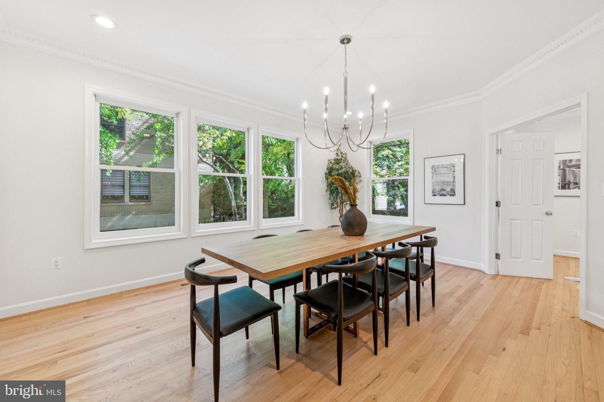 4730 Foxhall Crescent Northwest Washington, DC 20007 - Photo 10 of 37 a view of a dining room with furniture wooden floor and chandelier