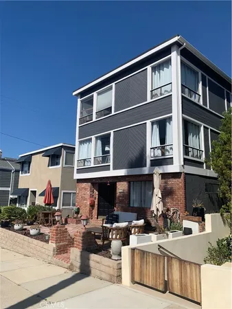 a front view of a house with many windows