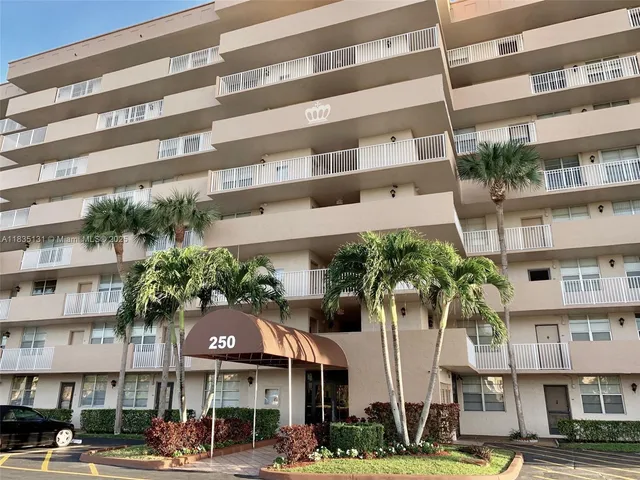 a front view of a building with lake view