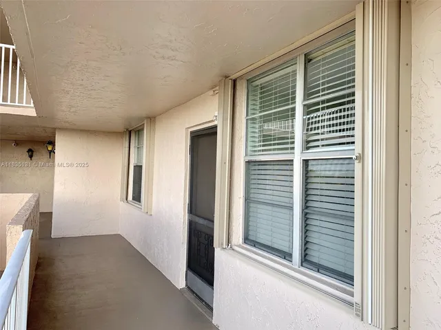 a view of hallway with windows