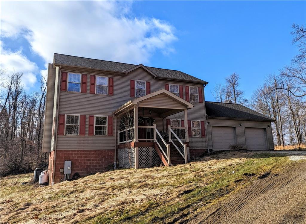 74 Tr784 Burgettstown, PA 15021 - Photo 1 of 22 a front view of a house with a yard