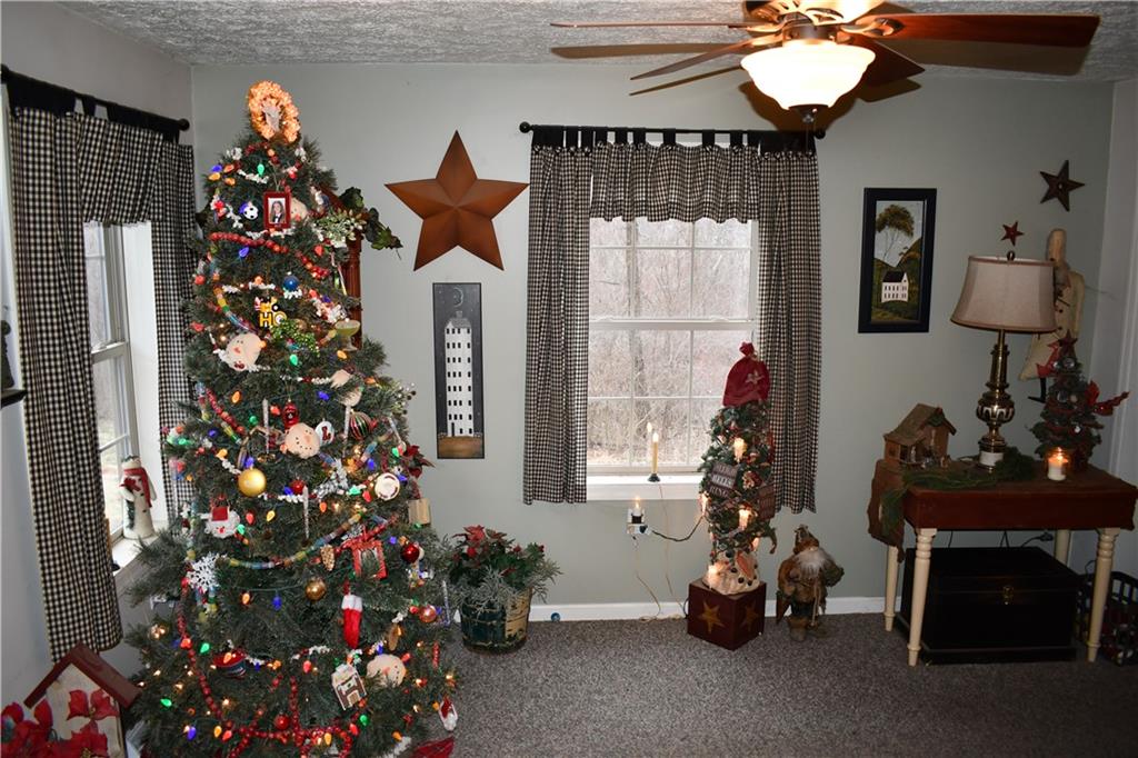 74 Tr784 Burgettstown, PA 15021 - Photo 14 of 22 a room with lots of flowers and a chandelier
