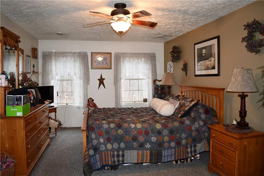 74 Tr784 Burgettstown, PA 15021 - Photo 21 of 22 a bedroom with a bed and dresser with mirror