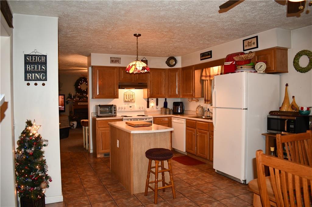 74 Tr784 Burgettstown, PA 15021 - Photo 7 of 22 a kitchen with a refrigerator and a stove