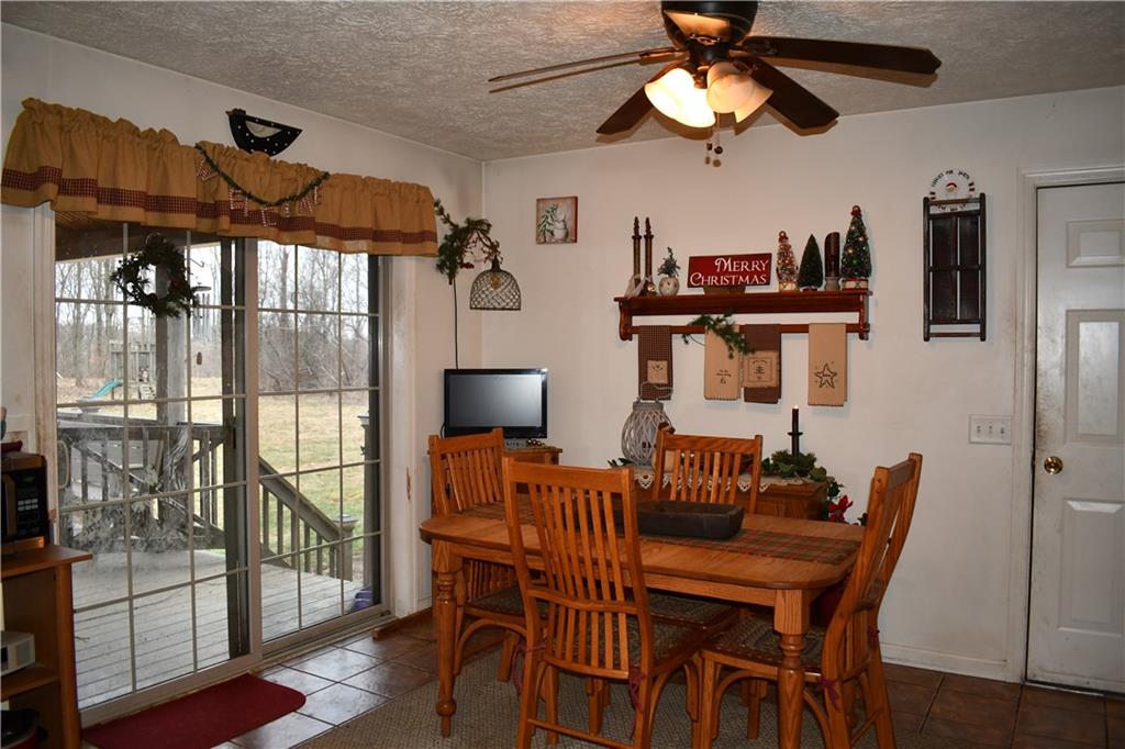 74 Tr784 Burgettstown, PA 15021 - Photo 8 of 22 a dining room with furniture a chandelier and wooden floor