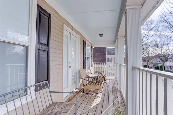 a view of a balcony with chairs