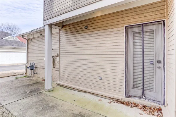 a view of a house with a door and a window