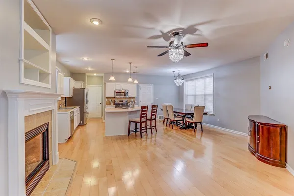 a view of a dining room with furniture window and wooden floor