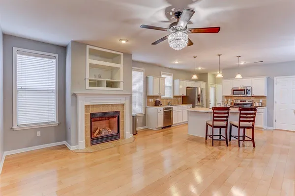 a view of a livingroom with furniture and a fireplace