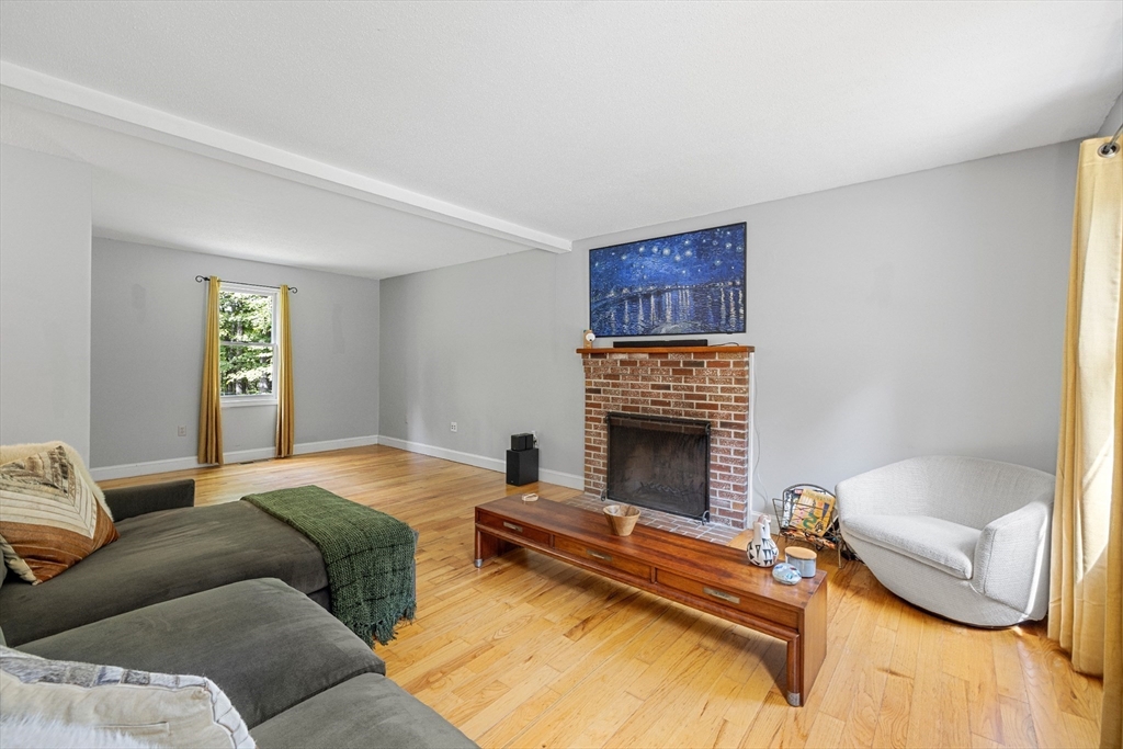 5 Friends Way Pepperell, MA 01463 - Photo 11 of 29 a bedroom with furniture and a fireplace