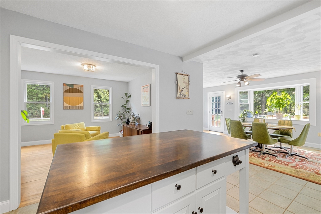 5 Friends Way Pepperell, MA 01463 - Photo 5 of 29 a view of kitchen island with granite countertop furniture and living room