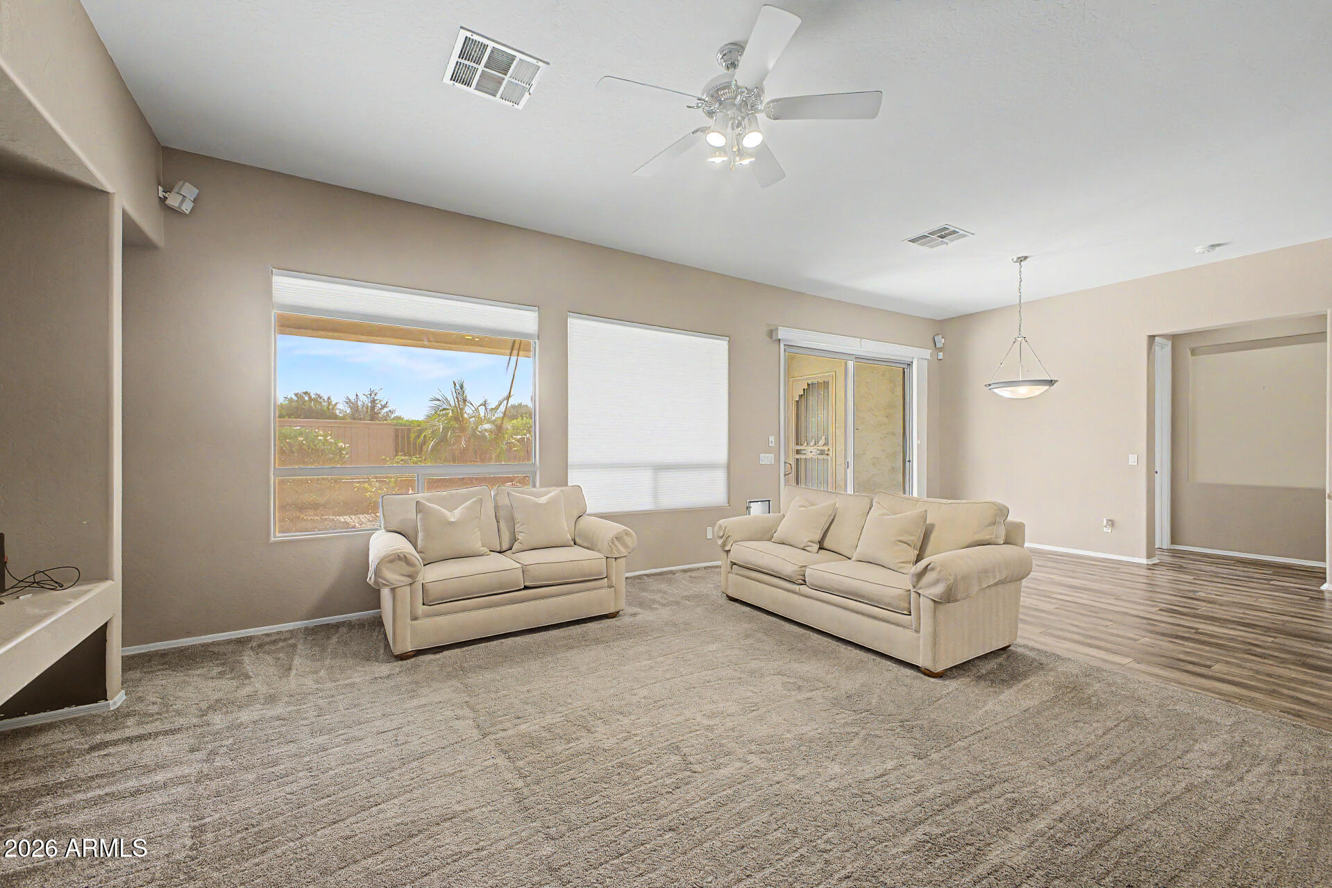 5090 South Ranger Trail Gilbert, AZ 85298 - Photo 5 of 50 a living room with furniture and a large window