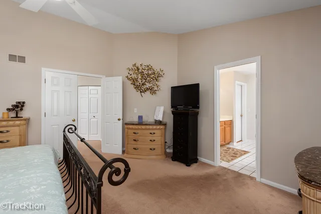 a bedroom with furniture and a window