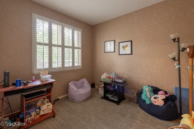 a bedroom with bed and a window