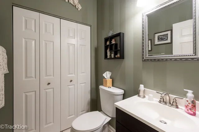 a white toilet sitting next to a bathroom sink