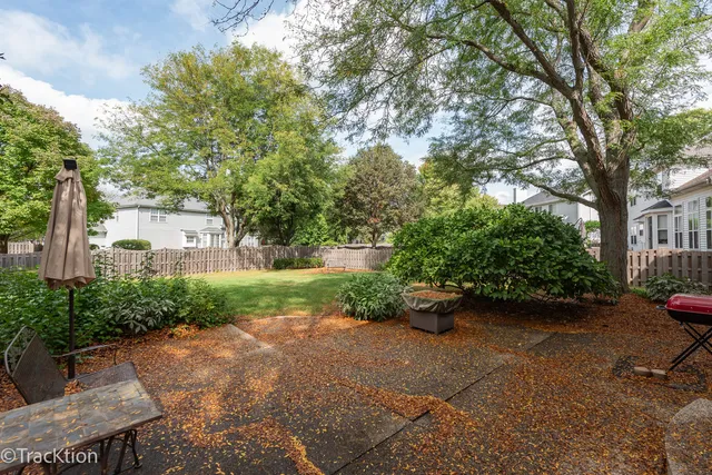 a view of a backyard with sitting area