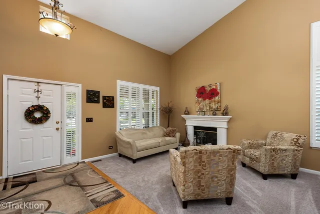a living room with furniture and a fireplace