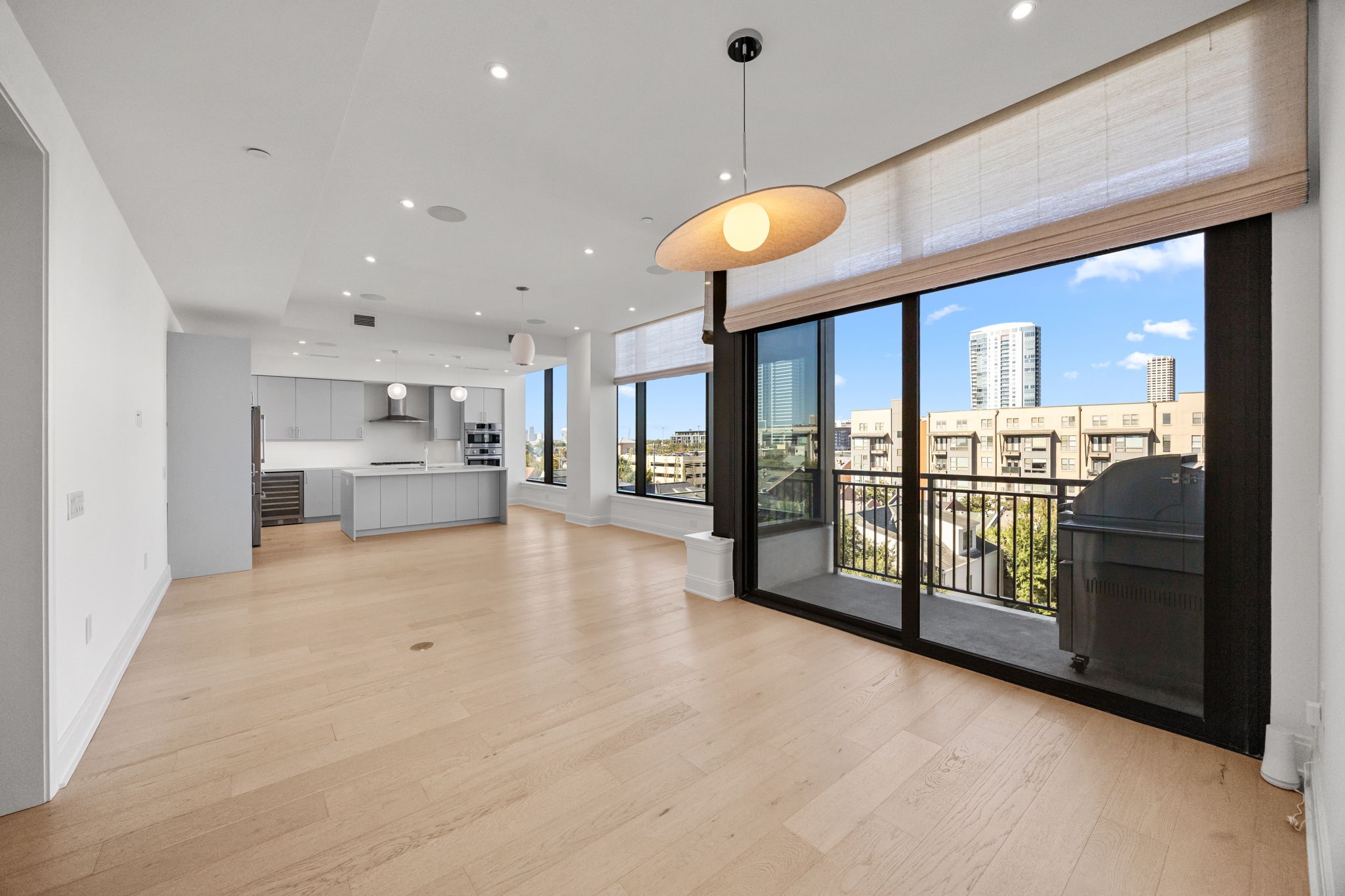 2323 West Main Street, Unit 506 Houston, TX 77098 - Photo 15 of 32 Upgrade: - Lighting: two pendant lights above kitchen island, living room pendant, dining area pendant, entry hall pendant, guest bedroom pendant, master bedroom entry pendant, master bedroom remote-controlled ceiling fan