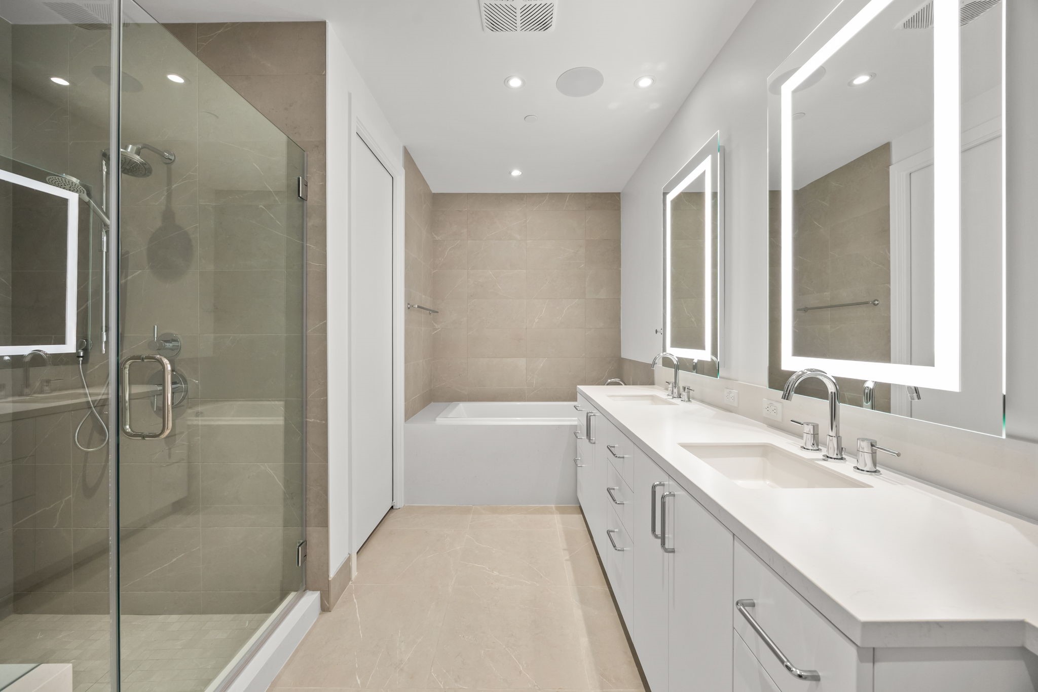 2323 West Main Street, Unit 506 Houston, TX 77098 - Photo 19 of 32 Upgrade: Removed sheet glass mirrors in all bathrooms; installed two lighted LED Luminart mirrors in master bathroom