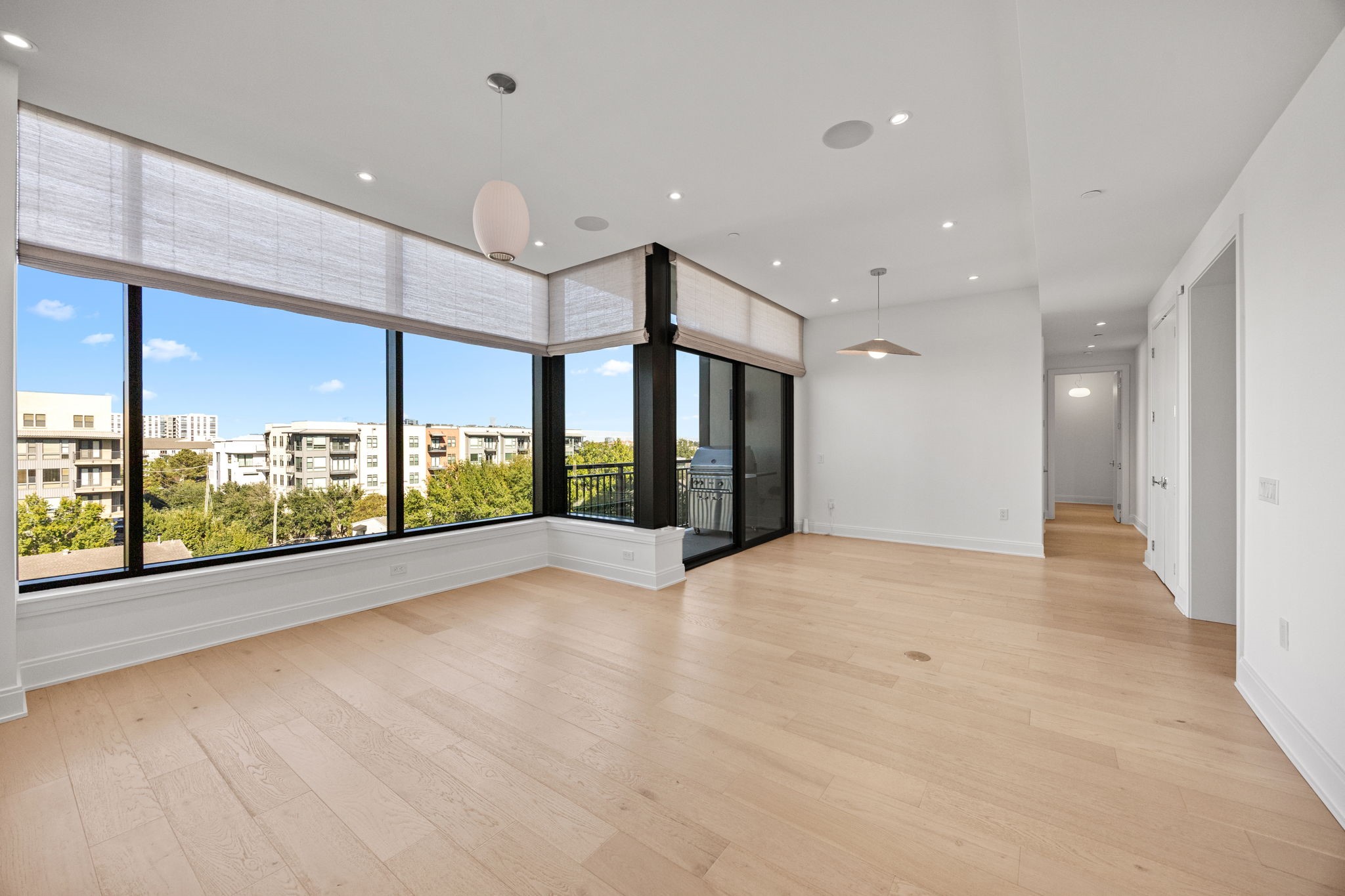 2323 West Main Street, Unit 506 Houston, TX 77098 - Photo 6 of 32 Custom, electric-powered Conrad brand Roman shades in all windows by Shade Shop; Lutron remote controls for each room and Lutron app programmable