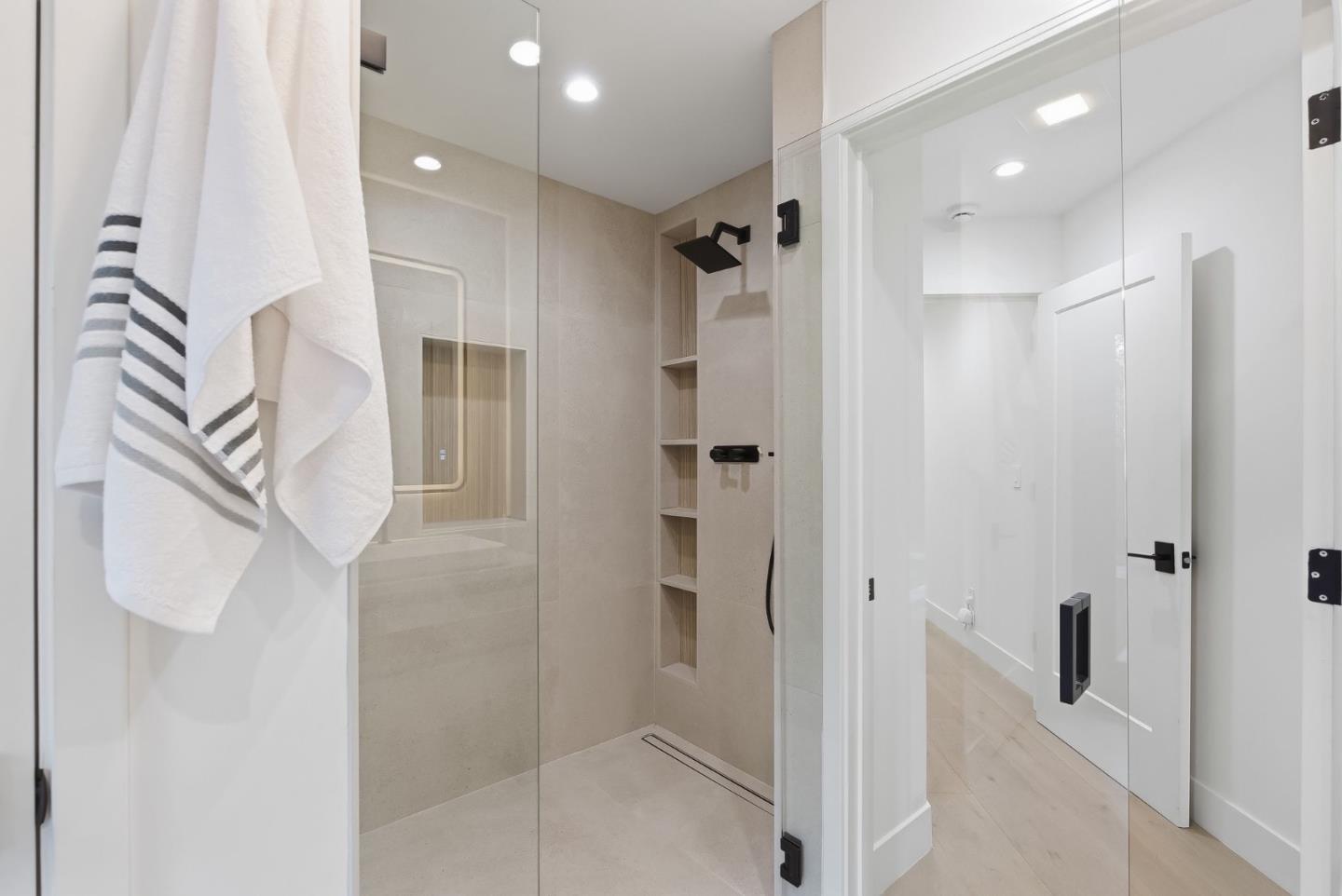 845 Pollard Road Los Gatos, CA 95032 - Photo 40 of 47 a bathroom with a shower and a glass door