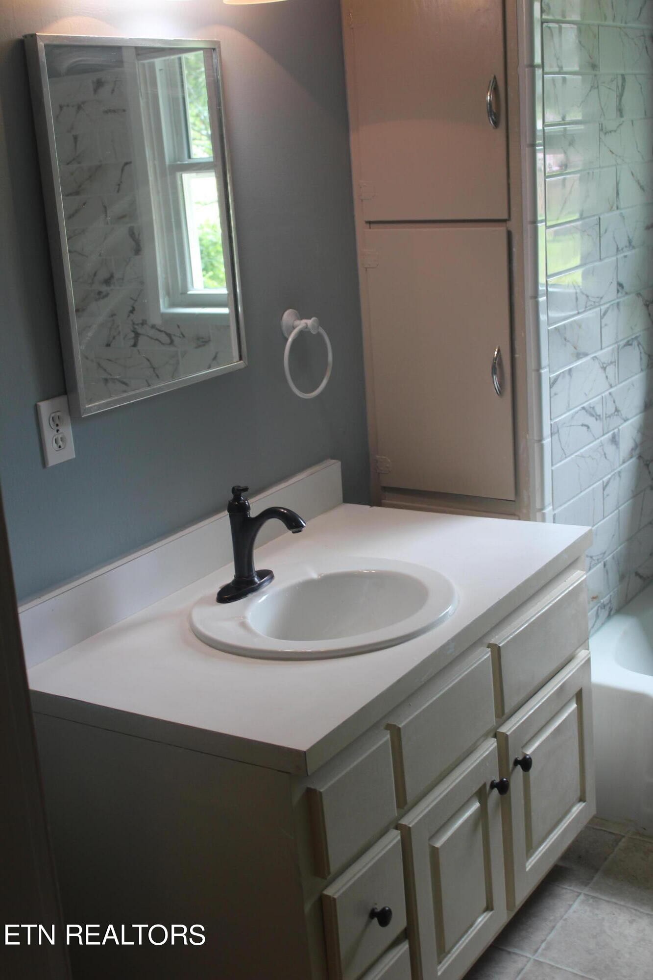 531 North Trigonia Road Greenback, TN 37742 - Photo 11 of 16 a bathroom with a sink and a mirror