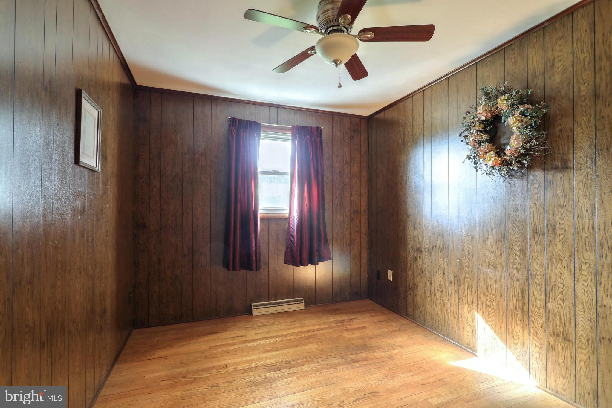 309 Ridgeview Road Seven Valleys, PA 17360 - Photo 26 of 51 3rd Bedroom - ceiling fan & refinished hardwood fl