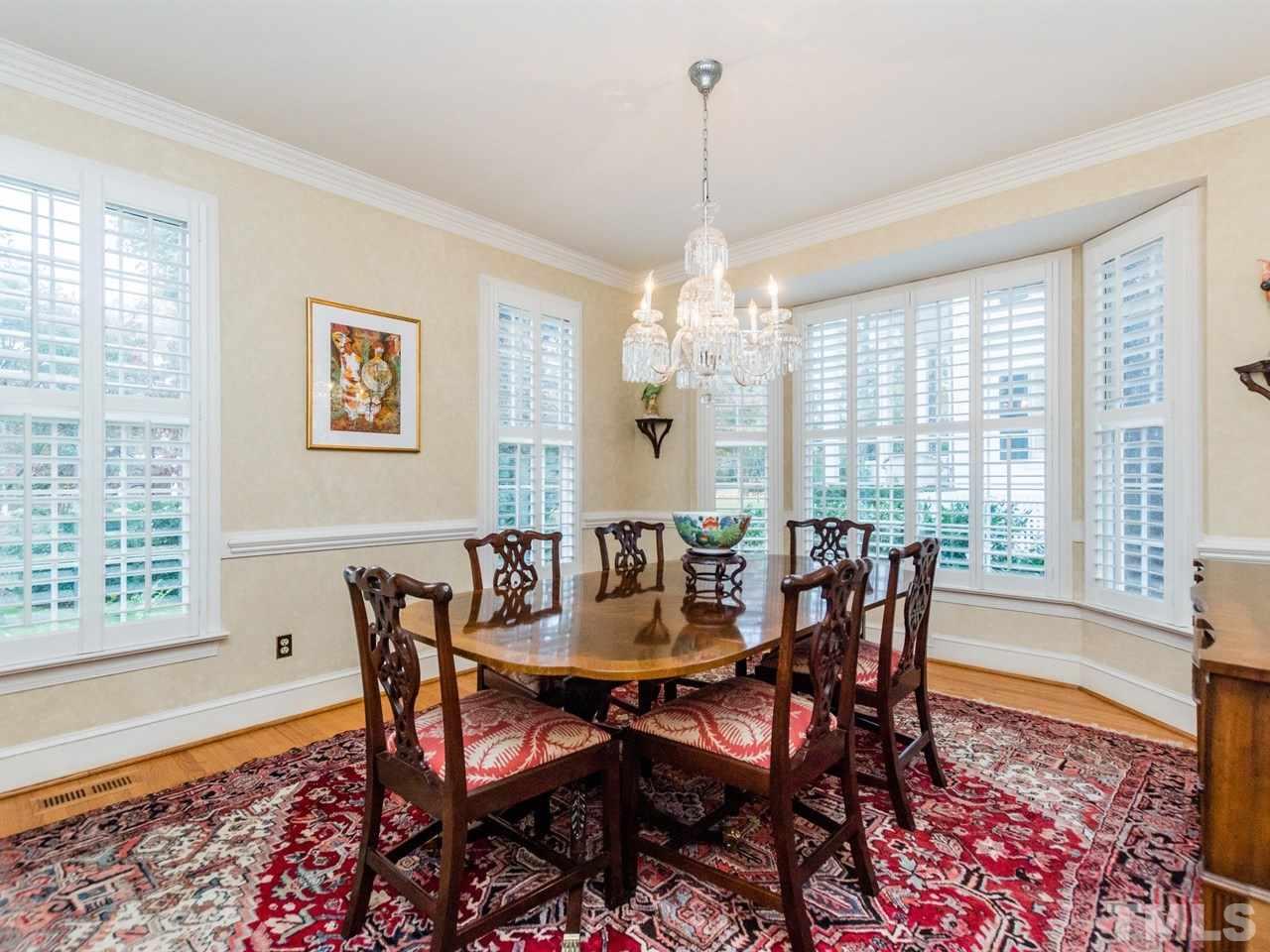 1804 Banbury Road Raleigh, NC 27608 - Photo 4 of 25 a view of a dining room with furniture window and wooden floor