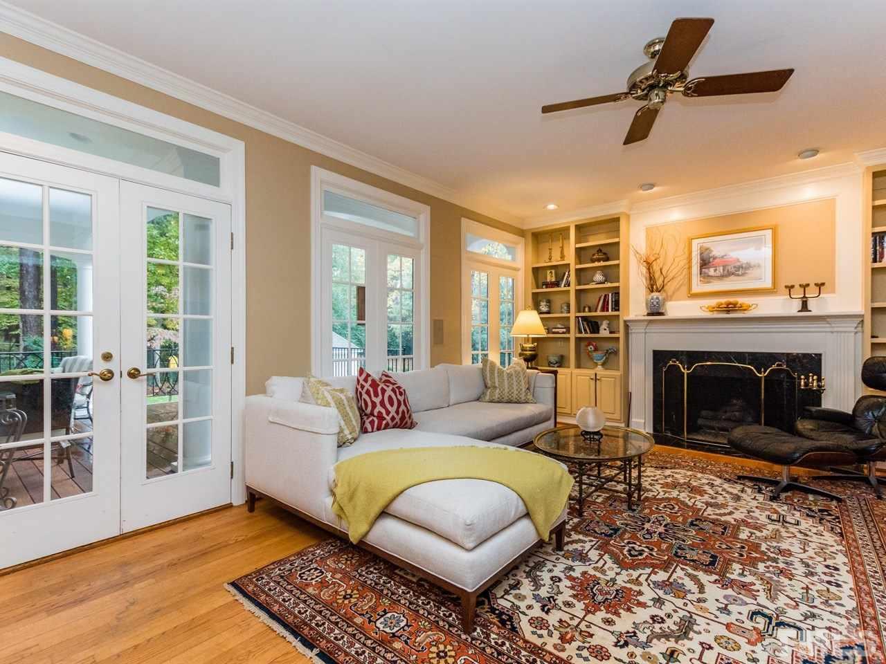 1804 Banbury Road Raleigh, NC 27608 - Photo 6 of 25 a living room with furniture and a fireplace