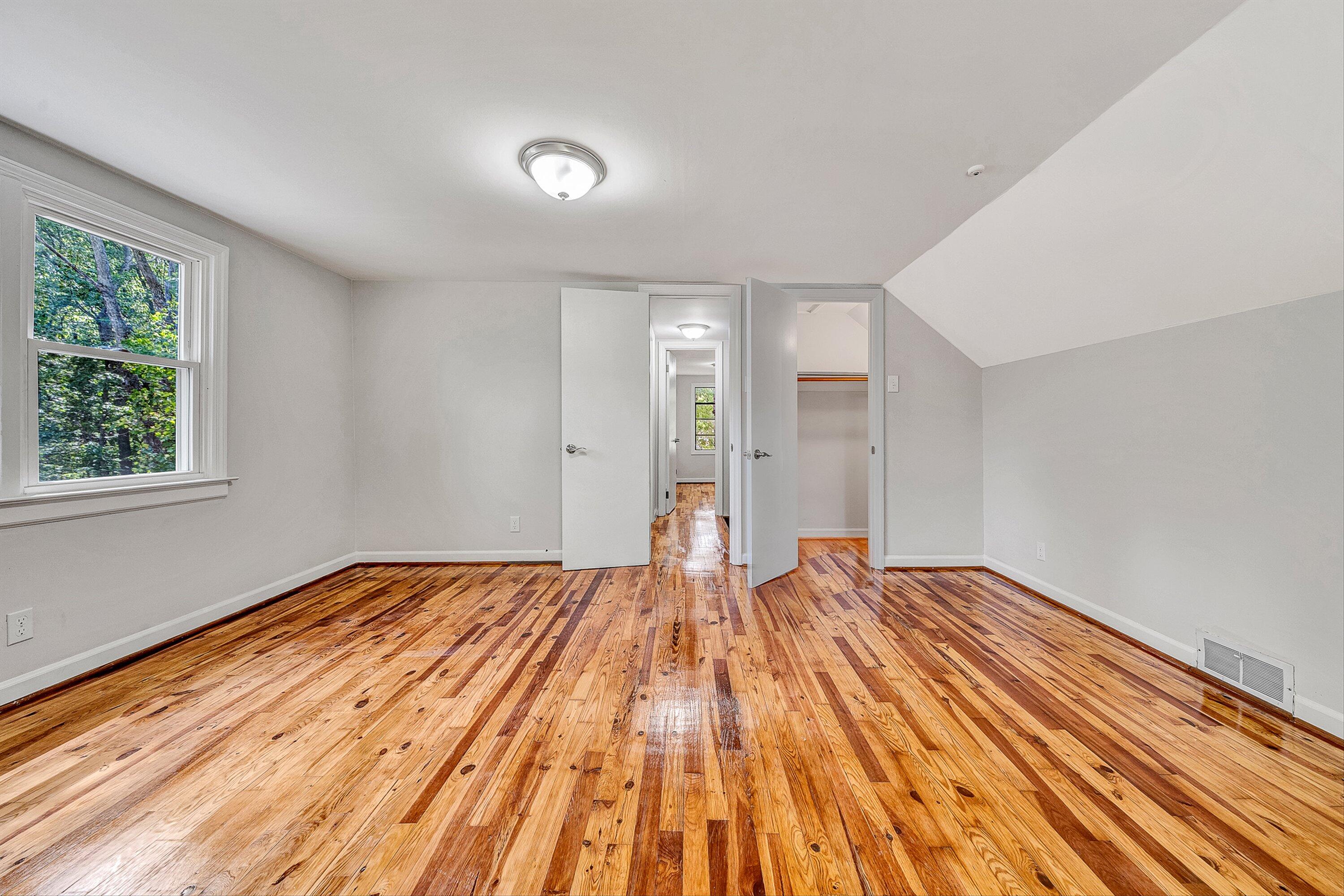 730 Texas Hollow Road Salem, VA 24153 - Photo 21 of 39 a view of empty room with wooden floor and fan