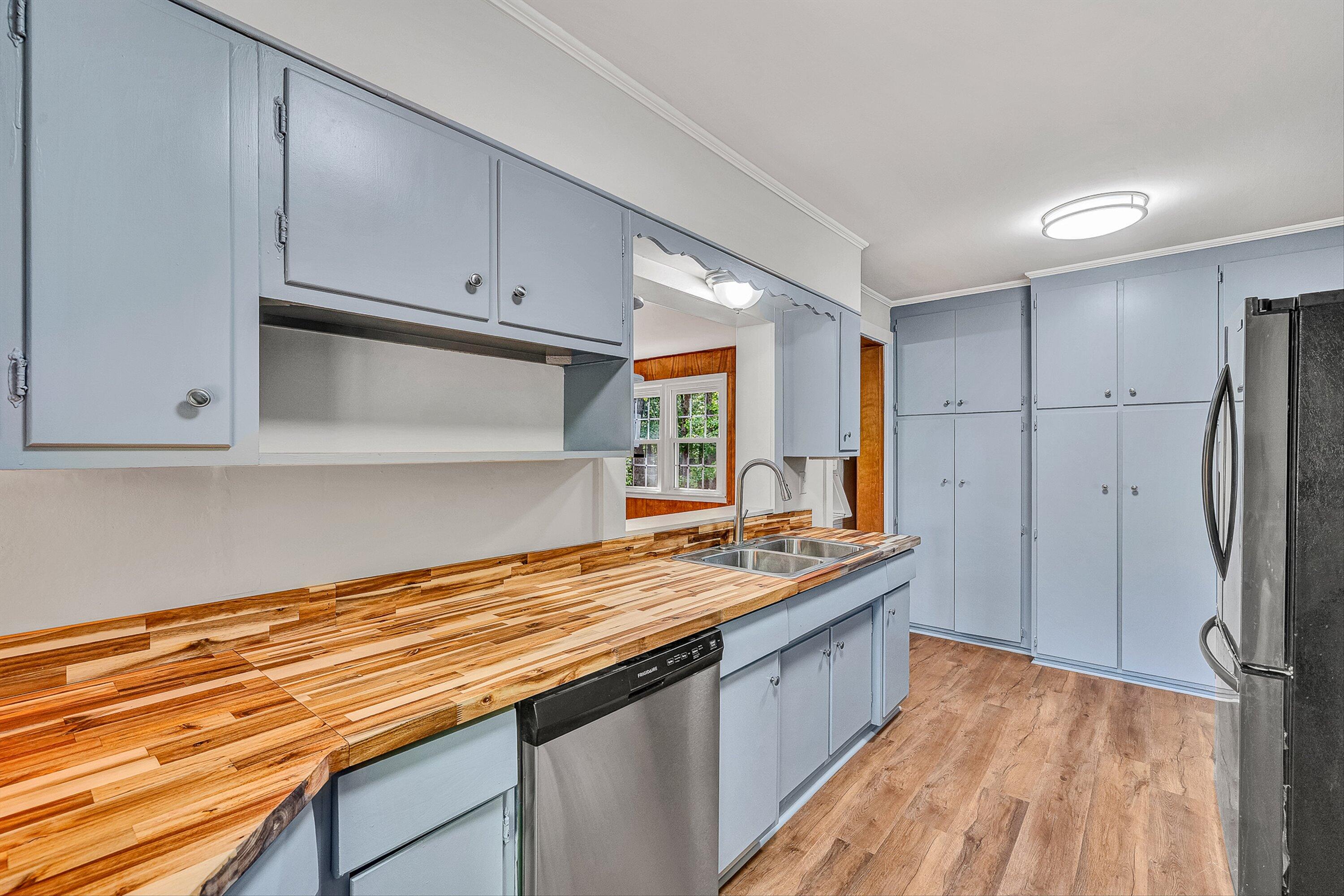 730 Texas Hollow Road Salem, VA 24153 - Photo 10 of 39 a kitchen with stainless steel appliances granite countertop a lot of counter space and wooden floors
