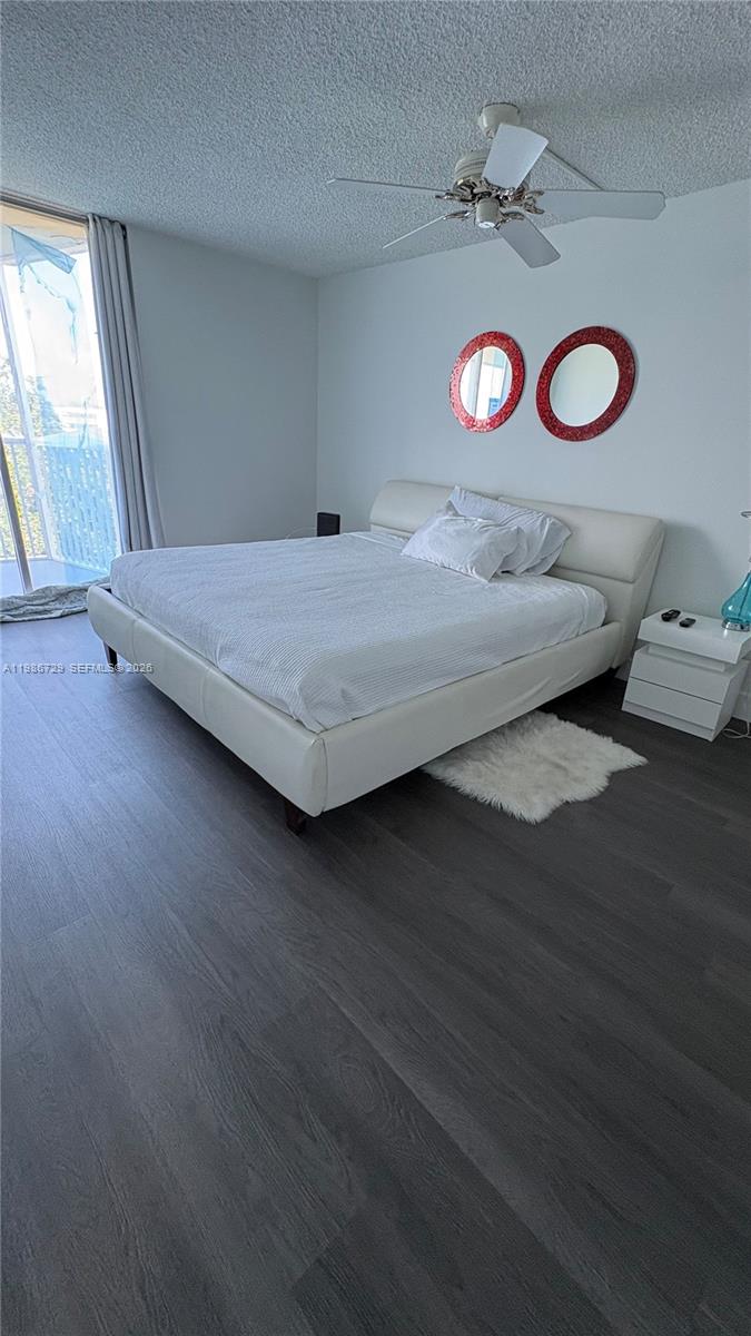 299 Northwest 52nd Terrace, Unit PHX Boca Raton, FL 33487 - Photo 1 of 29 a view of a room with wooden floor