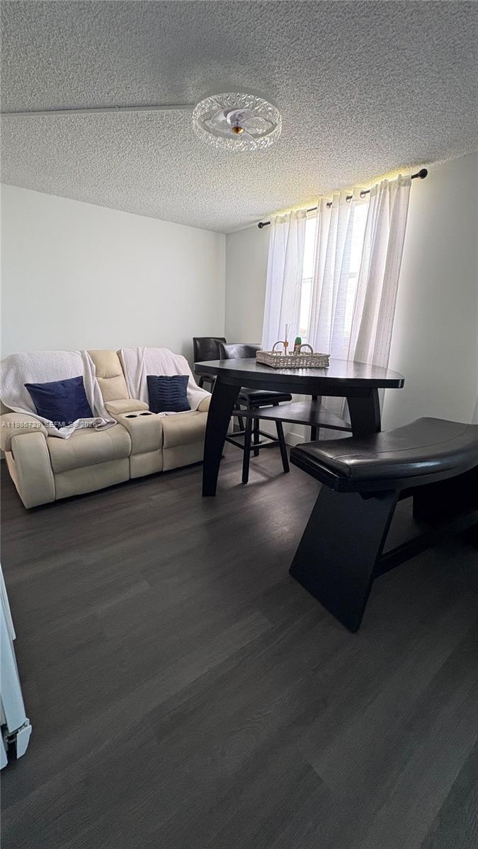 299 Northwest 52nd Terrace, Unit PHX Boca Raton, FL 33487 - Photo 18 of 29 a living room with furniture and a window